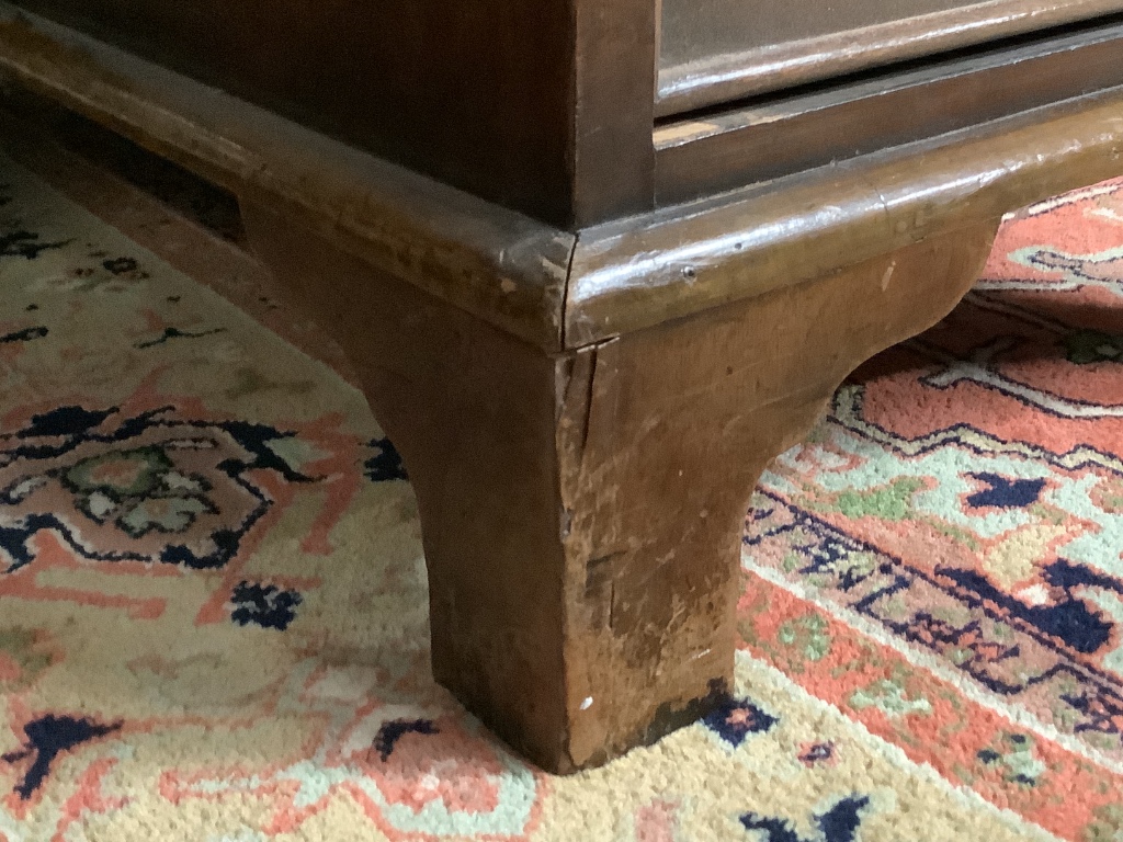 A Georgian style walnut desk with triple skiver, width 123cm depth 72cm height 74cm